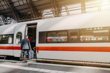 Businessman is waiting on a platform and getting on a train. A commuter in a suit begins his travel. - Stock Photo or Stock Video of rcfotostock | RC Photo Stock