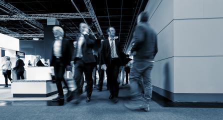 businesspeople walking in the corridor of an Exhibition- Stock Photo or Stock Video of rcfotostock | RC Photo Stock