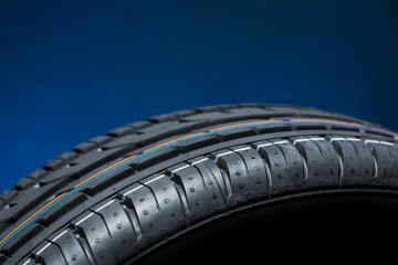 Car tire on black blue bakground - Stock Photo or Stock Video of rcfotostock | RC Photo Stock
