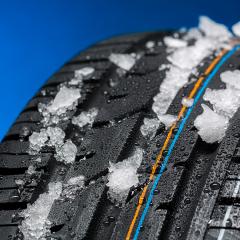 car tire with snow in winter on blue background- Stock Photo or Stock Video of rcfotostock | RC-Photo-Stock