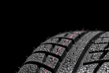 Car tires close-up Winter wheel profile structure with waterdrops on blue black background- Stock Photo or Stock Video of rcfotostock | RC-Photo-Stock