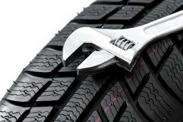 Car tires close-up with Wrench tool Winter wheel profile structure on white background- Stock Photo or Stock Video of rcfotostock | RC Photo Stock