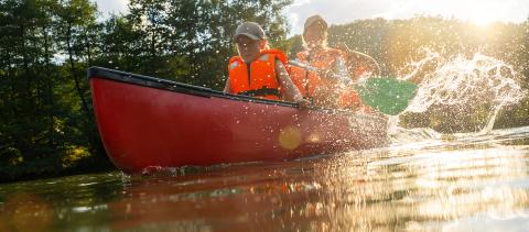 Child with mother and father in a  Canoe on river. Summer camp for kids. Kayaking and canoeing with family. Children on canoe. Family on kayak ride. Wild nature and water fun on summer vacation.- Stock Photo or Stock Video of rcfotostock | RC Photo Stock