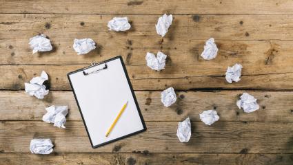 Clipboard with white sheet on wood background and Crumpled paper balls, with copyspace for your individual text.- Stock Photo or Stock Video of rcfotostock | RC Photo Stock