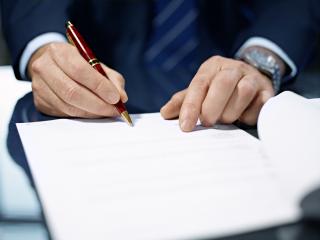 Close up of businessman signing a contract. : Stock Photo or Stock Video Download rcfotostock photos, images and assets rcfotostock | RC Photo Stock.: