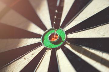 Close up of darts hitting the bulls eye on a dartboard- Stock Photo or Stock Video of rcfotostock | RC Photo Stock