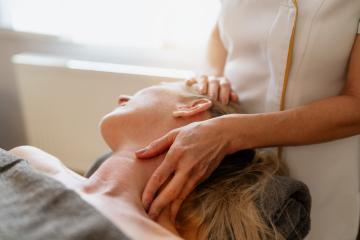 Close-up of a therapist giving a neck and shoulder massage to a woman lying down. beauty salon Wellness Hotel Concept image : Stock Photo or Stock Video Download rcfotostock photos, images and assets rcfotostock | RC Photo Stock.: