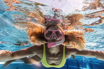 Close-up of a woman in snorkeling mask dive underwater in swimming pool of a Spa Hotel : Stock Photo or Stock Video Download rcfotostock photos, images and assets rcfotostock | RC Photo Stock.: