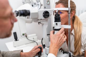 Close-up of an eye examination with an optometrist adjusting the- Stock Photo or Stock Video of rcfotostock | RC Photo Stock