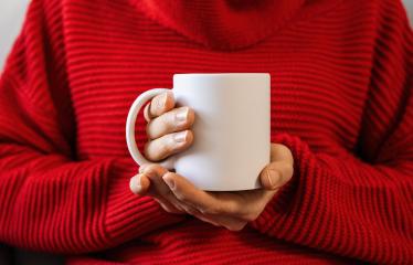Closeup of female hands with a mug of beverage. Beautiful girl in red sweater holding cup of tea or coffee in the morning sunlight. Mug for your design with copyspace for your individual text. : Stock Photo or Stock Video Download rcfotostock photos, images and assets rcfotostock | RC Photo Stock.:
