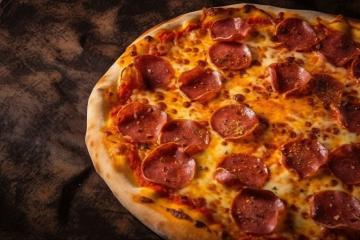 Close-up of pepperoni pizza with melted cheese on textured background- Stock Photo or Stock Video of rcfotostock | RC Photo Stock