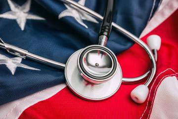Close-up Photo Of Stethoscope On American Flag- Stock Photo or Stock Video of rcfotostock | RC-Photo-Stock