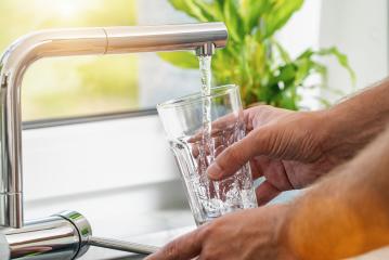 Closeup shot of a man pouring a glass of fresh water from a kitchen faucet : Stock Photo or Stock Video Download rcfotostock photos, images and assets rcfotostock | RC Photo Stock.: