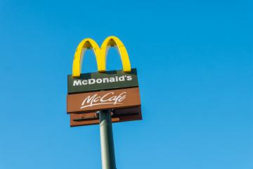 COLOGNE, GERMANY OCTOBER, 2017:McDonald's restauraunt sign against blue sky. The McDonald's Corporation is the world's largest chain of hamburger fast food restaurants.- Stock Photo or Stock Video of rcfotostock | RC Photo Stock