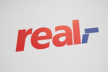 COLOGNE, GERMANY SEPTEMBER, 2017: Real Logo from Real supermarket. Real is a retail chain of the Metro Group, which operates several hundred supermarkets through the Real Group Holding GmbH in Germany- Stock Photo or Stock Video of rcfotostock | RC Photo Stock
