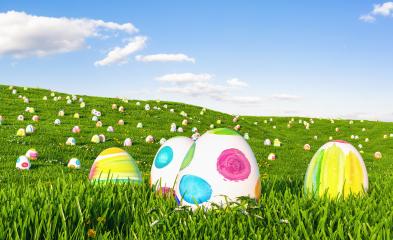Colorful easter eggs on meadow over bright spring cloudy sky, with copy space- Stock Photo or Stock Video of rcfotostock | RC Photo Stock