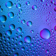 colorful Waterdrops nano effect on blue background- Stock Photo or Stock Video of rcfotostock | RC Photo Stock