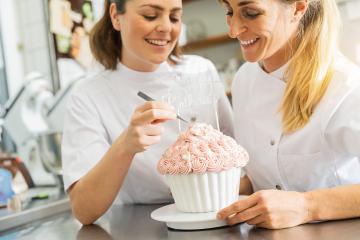 confectioners decorating big wedding cake muffin with candies and tweezers at pastry bakery : Stock Photo or Stock Video Download rcfotostock photos, images and assets rcfotostock | RC Photo Stock.: