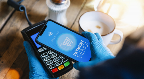 contact less payment on a mobile phone. Close up of a woman hand with gloves paying contactless with a smartphone screen application. Hand holding smart device to pay. Mockup cellphone screen.- Stock Photo or Stock Video of rcfotostock | RC Photo Stock