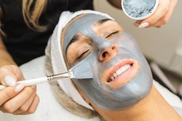cosmetologist making dead sea mud mask on face for rejuvenation - Stock Photo or Stock Video of rcfotostock | RC Photo Stock