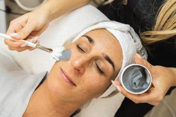 cosmetologist making mud mask on face at the cosmetology salon.  : Stock Photo or Stock Video Download rcfotostock photos, images and assets rcfotostock | RC Photo Stock.: