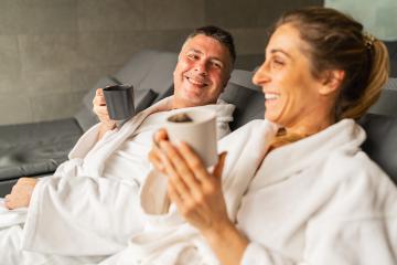 Couple in white robes laughing and holding mugs, reclining in a spa setting : Stock Photo or Stock Video Download rcfotostock photos, images and assets rcfotostock | RC Photo Stock.: