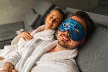 Couple relaxing in spa, man with blue gel cooling mask, woman in background- Stock Photo or Stock Video of rcfotostock | RC Photo Stock