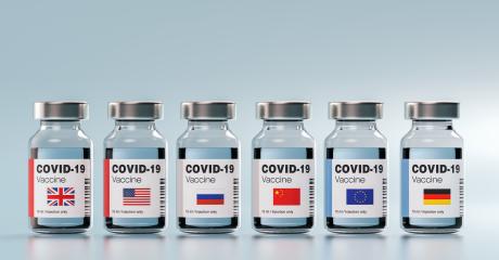 COVID-19 Coronavirus mRNA Vaccine and Syringe with different flags of England, USA, America, Russia, china, Europe, Germany. Concept Image for SARS cov 2 infection pandemic- Stock Photo or Stock Video of rcfotostock | RC Photo Stock
