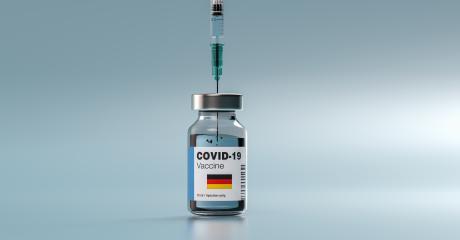 COVID-19 Coronavirus mRNA Vaccine and Syringe with flag of Germany on the label. Concept Image for SARS cov 2 infection pandemic- Stock Photo or Stock Video of rcfotostock | RC Photo Stock