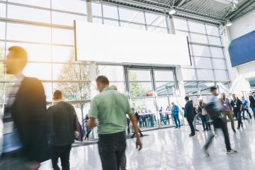 Crowd of anonymous people walking at a trade show, with banner for copy space : Stock Photo or Stock Video Download rcfotostock photos, images and assets rcfotostock | RC Photo Stock.: