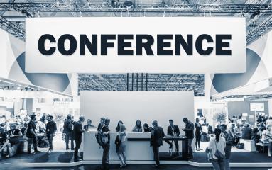 Crowd of people at a trade show booth with a banner and the text Conference.- Stock Photo or Stock Video of rcfotostock | RC-Photo-Stock