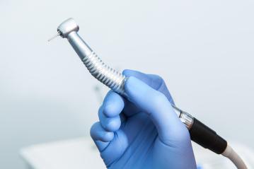 Dentist doctor hand holding dentist tools in Dentist Clinic- Stock Photo or Stock Video of rcfotostock | RC-Photo-Stock