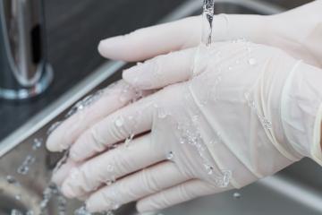 Dentist helper Washing hands with One-time gloves- Stock Photo or Stock Video of rcfotostock | RC Photo Stock