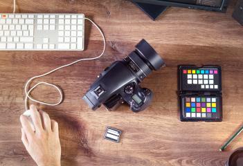 Desktop shot of a modern Digital Photo Camera with Laptop : Stock Photo or Stock Video Download rcfotostock photos, images and assets rcfotostock | RC Photo Stock.: