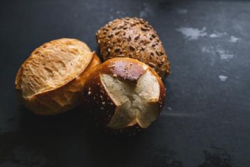 Different kinds of bread rolls on black board - Stock Photo or Stock Video of rcfotostock | RC Photo Stock