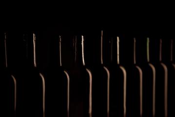 Different wine bottlenecks on dark background- Stock Photo or Stock Video of rcfotostock | RC Photo Stock