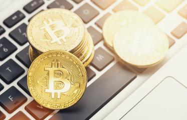 Digital cryptocurrency Bitcoin on a notebook- Stock Photo or Stock Video of rcfotostock | RC Photo Stock