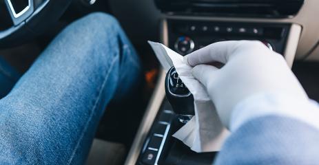 Disinfect motorists using the gear lever in the car in the case of Covid-19 coronavirus pandemic- Stock Photo or Stock Video of rcfotostock | RC-Photo-Stock
