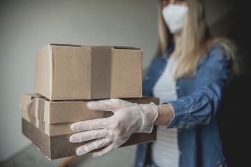 Dispatch postman bring parcels and post in covid 19 quarantine to the front home door with a face mask ffp 2 and protection gloves : Stock Photo or Stock Video Download rcfotostock photos, images and assets rcfotostock | RC Photo Stock.: