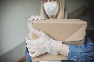 Dispatch postman bring parcels and post in covid 19 quarantine to the front home door with a face mask ffp2 and protection gloves : Stock Photo or Stock Video Download rcfotostock photos, images and assets rcfotostock | RC Photo Stock.: