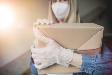 Dispatch postman bring parcels and post in covid 19 quarantine to the front home door with a face mask ffp2 and protection gloves : Stock Photo or Stock Video Download rcfotostock photos, images and assets rcfotostock | RC Photo Stock.: