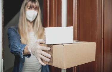 Dispatch postman bring parcels and post in covid 19 quarantine to the front home door with a face mask ffp2 and protection gloves : Stock Photo or Stock Video Download rcfotostock photos, images and assets rcfotostock | RC Photo Stock.: