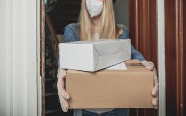 Dispatch postman bring parcels and post in covid 19 quarantine to the front home door with a face mask ffp2 and protection gloves : Stock Photo or Stock Video Download rcfotostock photos, images and assets rcfotostock | RC Photo Stock.: