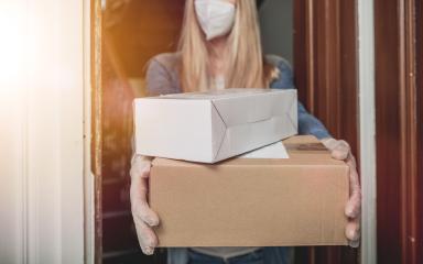 Dispatch postman bring parcels and post in covid 19 quarantine to the front home door with a face mask ffp2 and protection gloves : Stock Photo or Stock Video Download rcfotostock photos, images and assets rcfotostock | RC Photo Stock.: