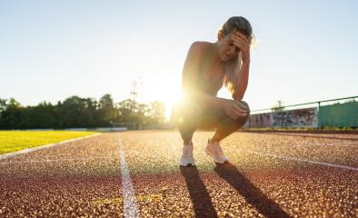 Distressed female athlete resting on a running track- Stock Photo or Stock Video of rcfotostock | RC Photo Stock