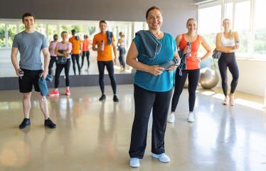 Diverse group of gym-goers with fitness gear in a bright gym, smiling and ready to workout. Teamwork Concept image : Stock Photo or Stock Video Download rcfotostock photos, images and assets rcfotostock | RC Photo Stock.: