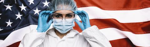 Doctor or Nurse Wearing Medical Personal Protective Equipment (PPE) Against The American Flag Banner, banner size- Stock Photo or Stock Video of rcfotostock | RC-Photo-Stock
