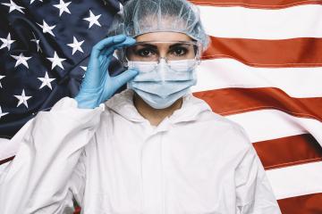 Doctor or Nurse Wearing Medical Personal Protective Equipment (PPE) Against The American Flag Banner. : Stock Photo or Stock Video Download rcfotostock photos, images and assets rcfotostock | RC-Photo-Stock.: