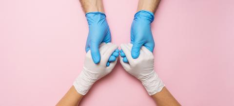 Doctor's hands in gloves holding woman hands in gloves. Medical banner with copy space on pink background. Care concept image- Stock Photo or Stock Video of rcfotostock | RC Photo Stock