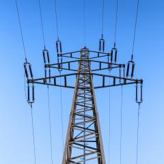 Electricity pylon close-up power pole high voltage against blue sky- Stock Photo or Stock Video of rcfotostock | RC Photo Stock